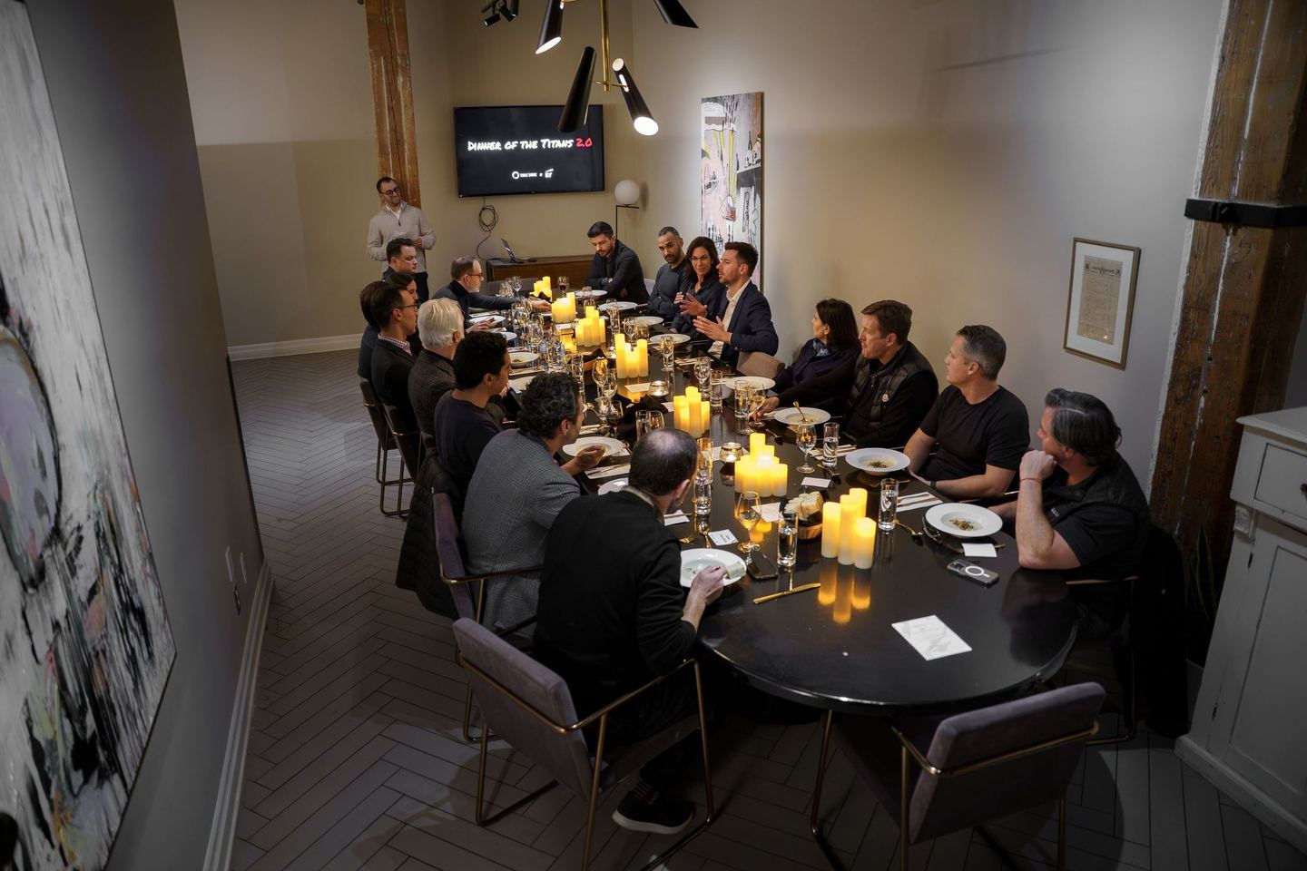 A Table Ronde dinner, guests around one long candlelit table